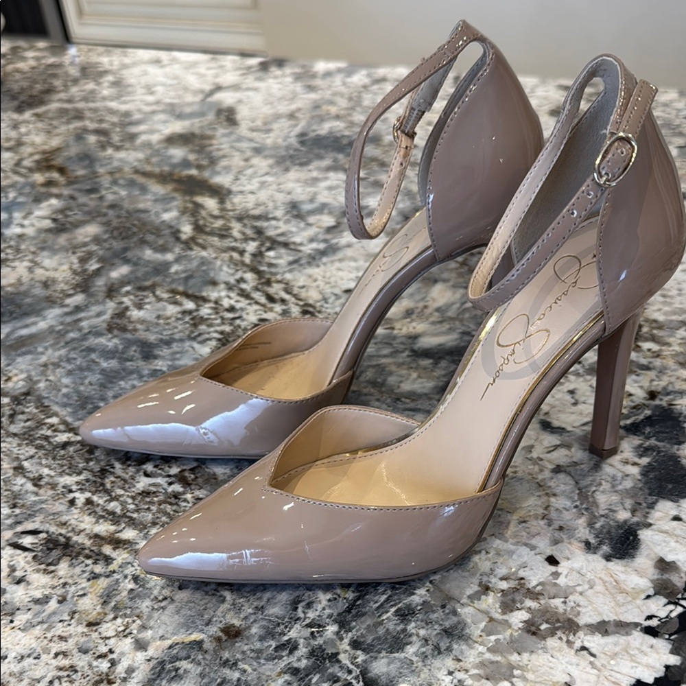 Elegant Taupe Patent Leather Heels, worn indoors..